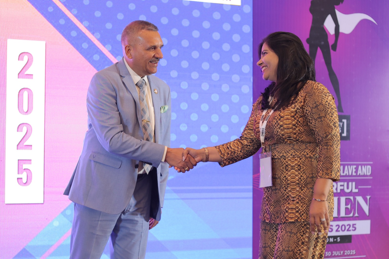 Dr. Renu Rana being felicitated on stage, 2025